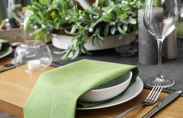 Dining table with beautiful setting for Christmas celebration indoors