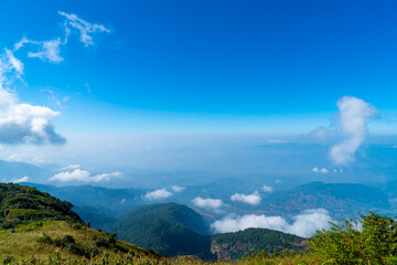beautiful mountain layer with clouds and blue sky