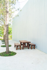 empty wood outdoor patio table and chair set