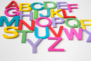 Colorful wooden english letters A-Z on white background