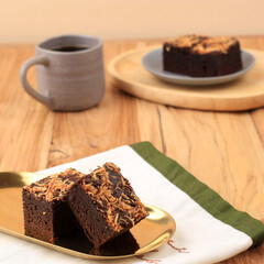 Fresh Brownie with Shredded Cheese on Top. Delicious Chocolate Pie, Served with A Cup of Coffee