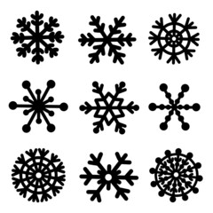 Snowflakes vector icon set. Hand-drawn black silhouettes of ice crystals isolated on white background. Collection of simple flat elements, seasonal doodles. Festive concept for decoration, design.