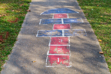 Hopscotch game on the sidewalk in Marsalis Harmony Park in New Orleans, Louisiana, USA