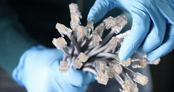 Master in gloves holding lot of network cables rj45 4k slow motion movie