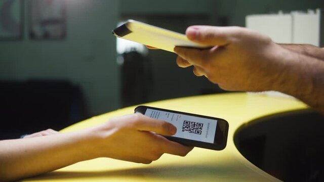Vaccination passport qr code control, woman checking on phone European coronavirus covid 19 vaccine passport to enter cafe, restaurant. Tourist show international certificate in airport terminal.