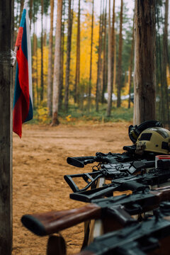 Various Weapon Models Lie On The Arms Rack Of The Rifle Landfill During Military Sports Competition