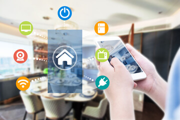 Smart home automation app on mobile with home interior in background. Internet of things concept at...