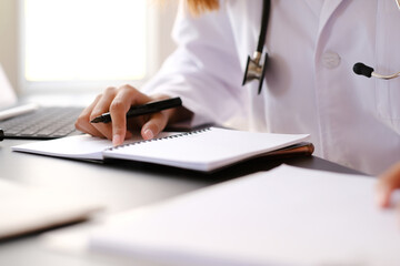 Doctors at hospital working in the doctor office.