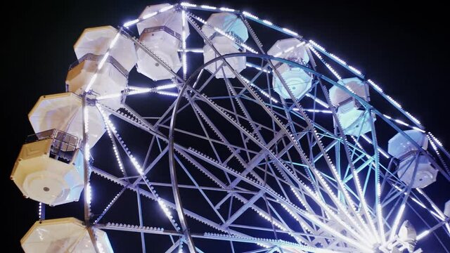 Ferris wheel at night in Italy, lights