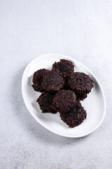 Wingko coklat or chocolate wingko is javanese traditional pancake made from grated coconut, gluotinous fluor and sugar.