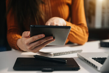 business documents on office table with smart phone and digital tablet and graph financial