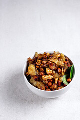 Kering tempe or pencok, Sweet and spicy tempeh with potatoes and peanuts, is one of the most delicious Indonesian tempeh dish.
