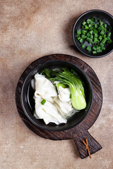 Sup pangsit or wonton soup is Chinese wonton dumpling in clear soup