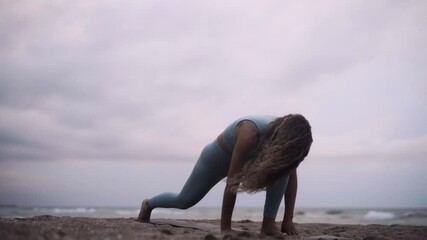 Connection to god practicing Yoga Barcelona beach Spain