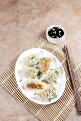 Gyoza is Japanese dumplings with chicken and vegetables.