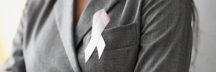 Symbol of pink ribbon on female breast
