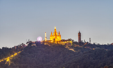 Mount Tibidabo in Barcelona with the church and the amusement park at night