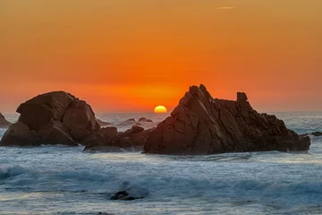 Foto op Plexiglas Lovely sunset on a rocky beach at the portuguese atlantic coast © elxeneize