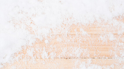 Table snow. Winter wooden texture background. Christmas board with old rustic wood wall, white frozen ice. Merry Christmas holiday card pattern.