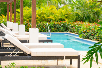 chaise lounge by the pool