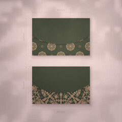 Business card in green color with brown mandala pattern for your brand.