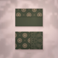 Business card in green color with Greek brown ornament for your contacts.