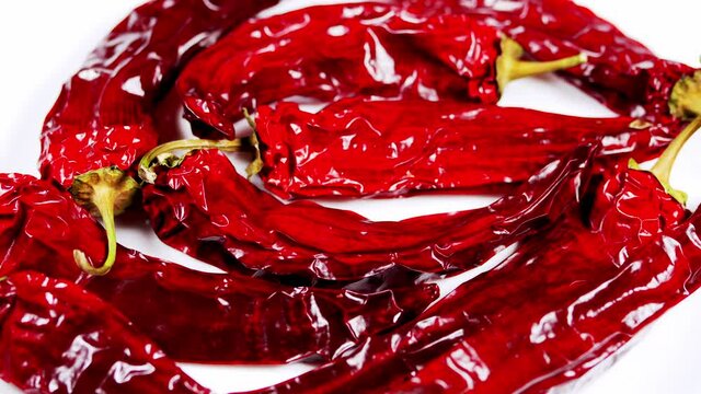 Dried red chili peppers background. Spicy food concept. Red chilies is commonly used as a raw material for spicy chili sauce.