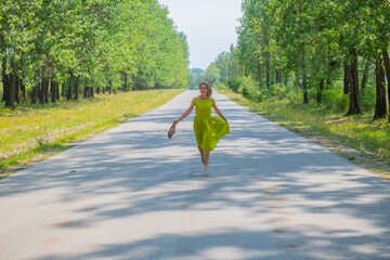 barefoot woman running in the middle of the road