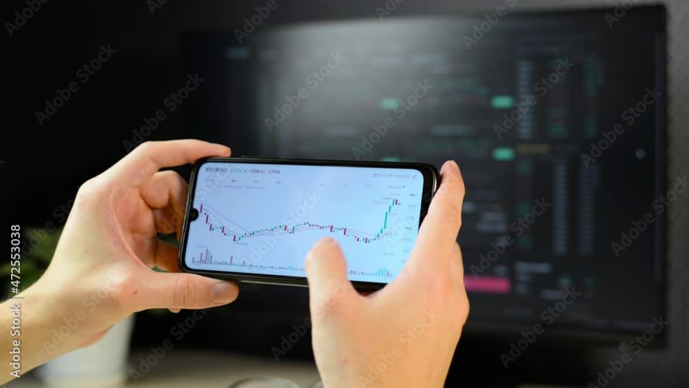 Poster investor trader analyzes cryptocurrency stock exchange chart, bitcoin price using mobile application