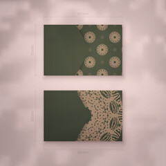 Business card in green with abstract brown pattern for your personality.