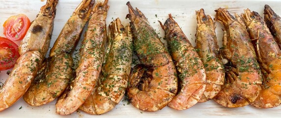 Big delicious fried king shrimps, tasty seafood dish, food photography, close up.