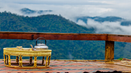 The close-up natural background of green rice fields, behind a large mountain and mist flowing...