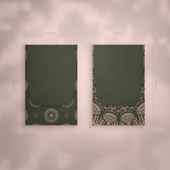 Business card in green with brown mandala ornament for your business.