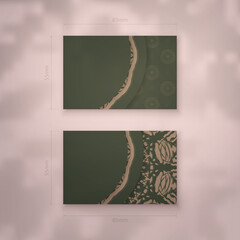 Business card in green with greek brown pattern for your contacts.