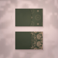 Business card in green with Indian brown ornament for your contacts.