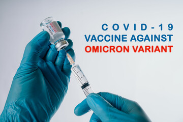 Omicron variant of SARS-CoV-2. New B.1.1.529 Variant of concern. Doctor holds vaccine against new...