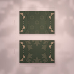 Business card in green with luxurious brown pattern for your business.