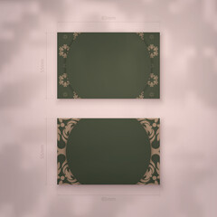 Business card in green with vintage brown ornament for your brand.