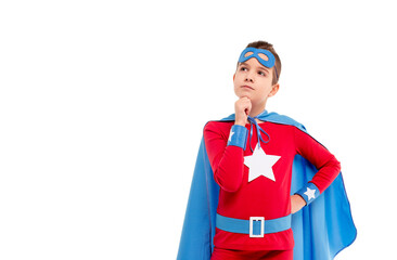 Thoughtful child in superhero costume looking away