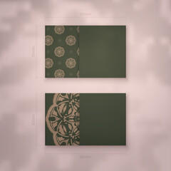 Business card in green with vintage brown pattern for your business.