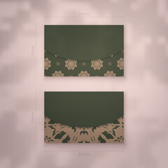 Business card template in green color with abstract brown ornament for your brand.