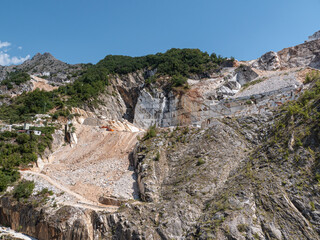 Fototapeta na wymiar View of the Carrara Marble Quarries with Excavation Equipment ready for Work
