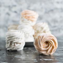 Delicious marshmallow close up on gray background with copy space