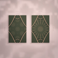 Business card template in green color with Indian brown ornaments for your brand.