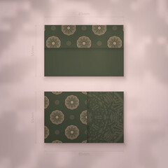 Business card template in green color with luxurious brown pattern for your contacts.