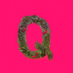 Festive, winter, Christmas season natural pine, holly branches, red berries, unique collection of letters, numbers and symbols. Letter Q
