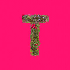 Festive, winter, christmas season natural pine, holly branches, red berries, unique collection of letters, numbers and symbols. Letter T
