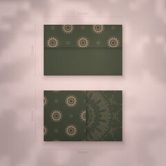 Business card template in green color with vintage brown pattern for your contacts.