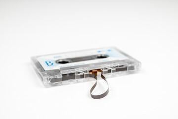 Old audio cassette with loose tape