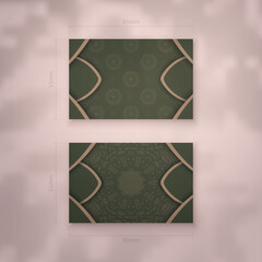 Business card template in green with brown mandala ornament for your personality.